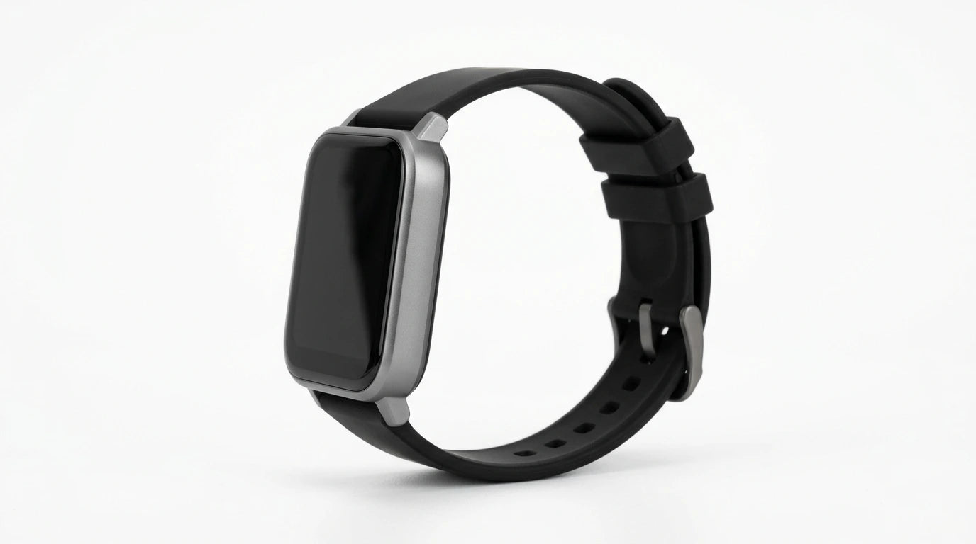 smart tech store Canada. premium tech accessories Canada. Techtron SWH18 (T52 / T67) Smart Watch. Gallery image 8. The smartwatch is positioned at a slight angle, showcasing its rectangular face and black silicone strap. The body features a sleek silver trim around the screen, which is currently dark and unlit. The background is a seamless white, emphasizing the watch's design. The strap has multiple holes for adjustment, and a metal buckle secures it in place.