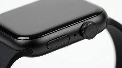 smart tech store Canada. premium tech accessories Canada. Techtron SWH18 (T52 / T67) Smart Watch. Gallery image 9. The image shows a close-up view of a black smartwatch, angled slightly to the right. The watch features a smooth, glossy screen with a minimal bezel, and a round, textured crown on the right side for navigation. Below the crown, there is a rectangular button and a small microphone hole. The watch band is made of a matte black material, seamlessly connecting to the watch body.