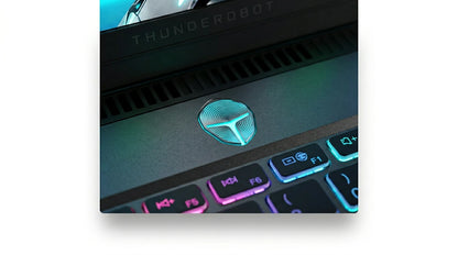 future tech gadgets Canada. smart tech store Canada. ThundeRobot ZERO16 Pro U7255HX57TE1Q360ARB Gaming Laptop. Gallery image 9. The image features a close-up view of a laptop's keyboard area, prominently displaying a glowing logo in the center, which is a stylized shield design illuminated in blue and green hues. The keys are backlit with a gradient of colors, transitioning from pink to blue, enhancing the modern aesthetic.